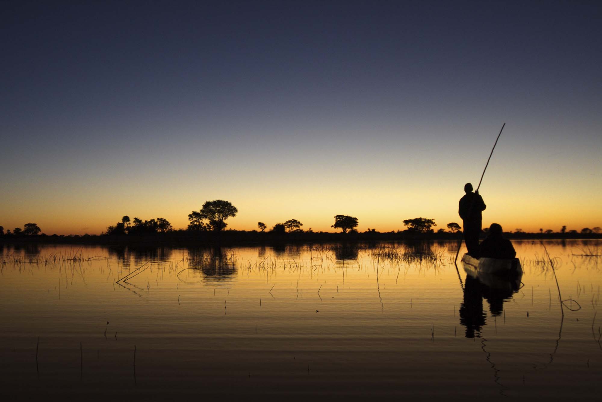 Africa-Botswana-Okavango-delta-makoro-canoe-sunset